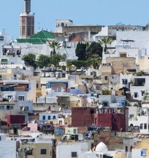 a view of a city with white buildings