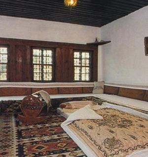 a large room with a large bed and a rug