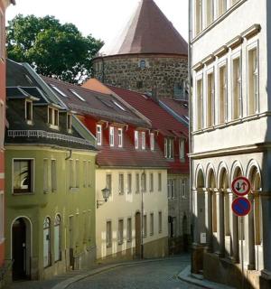 an empty street in a city with buildings