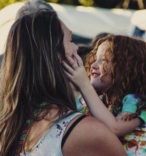 two girls are sitting next to each other