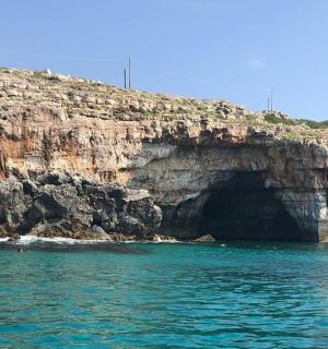 a cave in the side of a rocky cliff