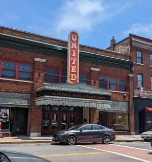 an old brick building with a large sign on it