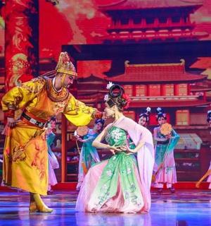 a man and a woman in traditional chinese dances on the stage
