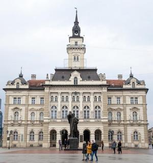 a large building with a statue in front of it