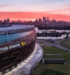 a view of an olympic stadium at sunset