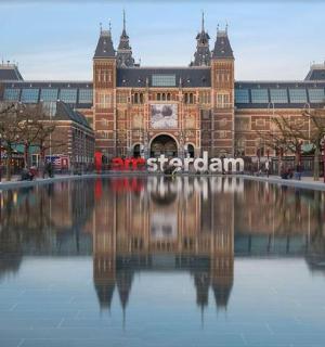 a building with a pool of water in front of it
