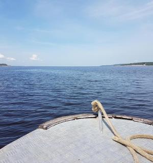 a boat with a rope on a body of water