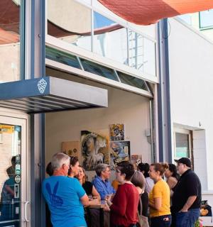 a group of people standing outside of a building