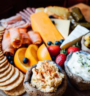 a plate of food with bread and cheese and fruit