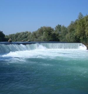 a waterfall in the middle of a river