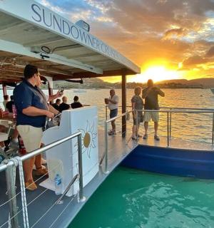 a group of people on a boat in the water