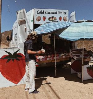 a man standing in front of a food truck