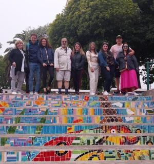 a group of people standing on top of a monument