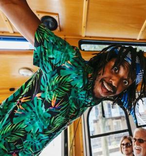 a man in a green shirt on a bus