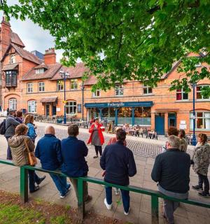 a group of people walking down a street