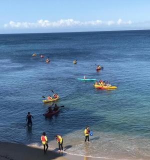 a group of people in boats in the water