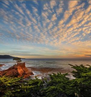 a view of the ocean with a cloudy sky