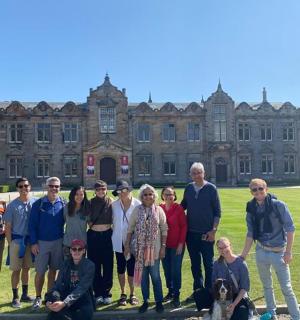 a group of people standing in front of a building