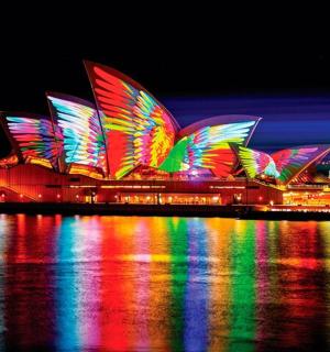 a large opera house lit up with colorful lights