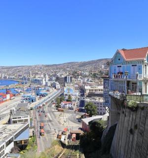 a city with a blue building on top of a building