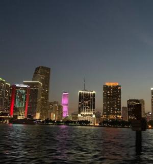 a view of a city at night from the water