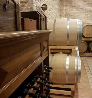 a wine cellar with a bunch of wine barrels