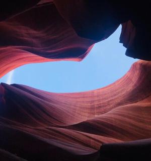 a person is in a slot canyon