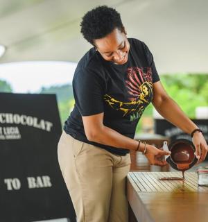 a woman is preparing a football on a table