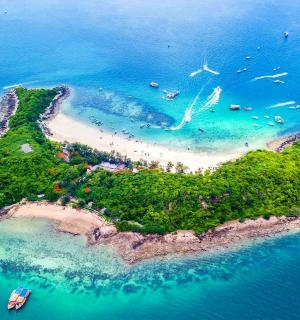 an island in the ocean with people on it
