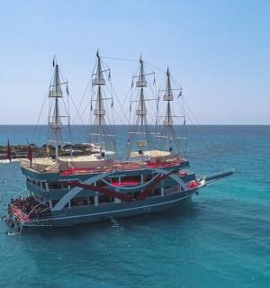 a large boat in the ocean with people on it
