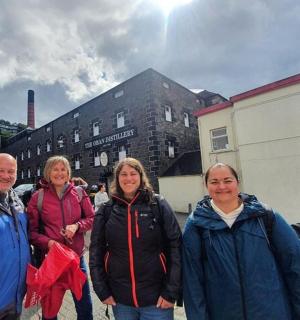 a group of people standing in front of a building