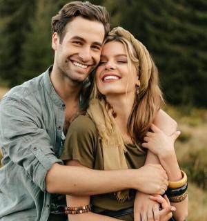 a man and a woman posing for a picture