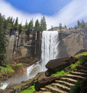 a waterfall on the side of a mountain