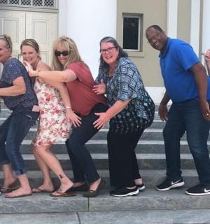 a group of people standing on some steps