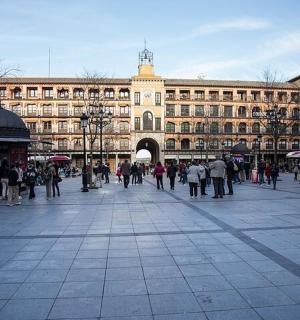 a large building with people walking in front of it