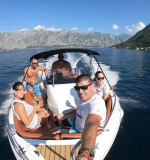 a group of people on a boat in the water