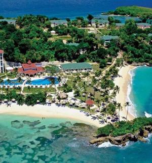 an aerial view of a resort on a beach