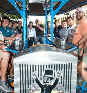 a group of people sitting on a trolley
