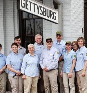 a group of people standing in front of a building