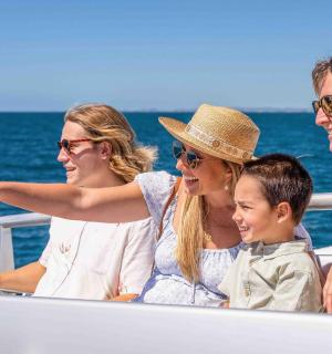 a group of people sitting on a boat