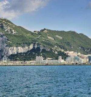 a mountain in the middle of a body of water
