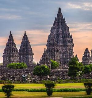 a view of the temples of angkor wat at sunset