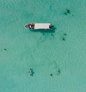 an aerial view of a boat in the water