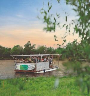 a group of people on a boat on a river