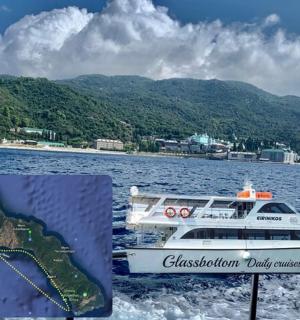 a boat on the water with mountains in the background