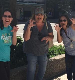 three women are talking on their cell phones