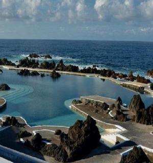 a swimming pool in the middle of the ocean