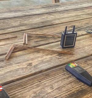 a group of electronic devices on a wooden floor