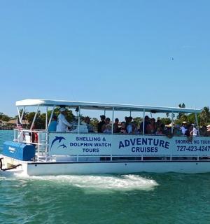 a boat full of people on the water