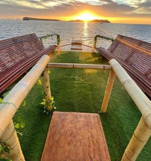a park bench with the sunset in the background